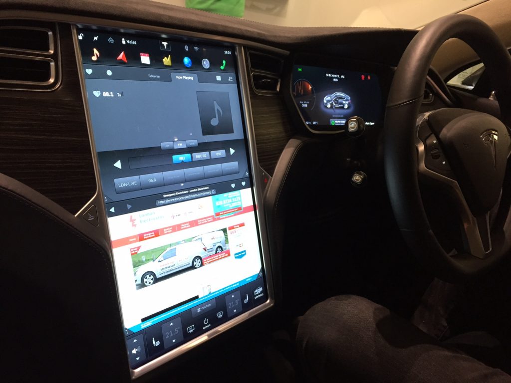 A picture showing the touchscreen dashboard of a Tesla that is on the London Electricians website